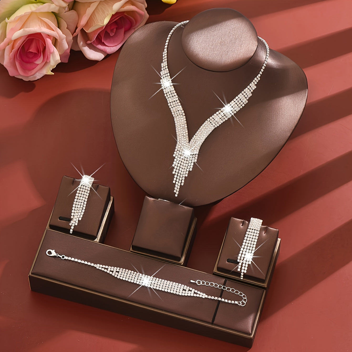 A Stylish Silvery Jewelry Set Adorned with Rhinestones, Including a Necklace, a Pair of Earrings, And a Bracelet, Perfect for Accessories at Balls And Parties.