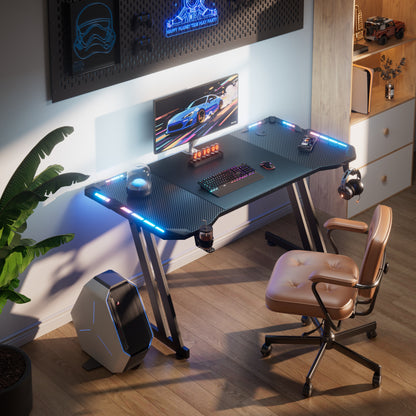 RGB Gaming Desk with LED Lights and Mouse Pad, Large Ergonomic Computer Desk with Cup Holder & Headphone Hook,Modern Carbon Fiber Design for PC Gaming & Home Office,Black