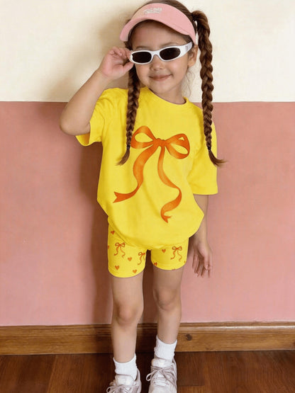 2pcs Set of Casual Loose-fitting Round-neck Short-sleeve T-shirt and Shorts for Girls Aged 1-6, Featuring Cute Heart and Bowknot Prints, Suitable for Daily Wear, Outings, Home, and School in Spring and Summer, Perfect for Outdoor