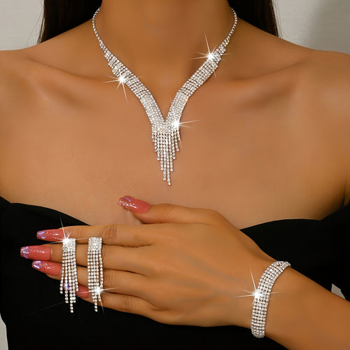 A Stylish Silvery Jewelry Set Adorned with Rhinestones, Including a Necklace, a Pair of Earrings, And a Bracelet, Perfect for Accessories at Balls And Parties.