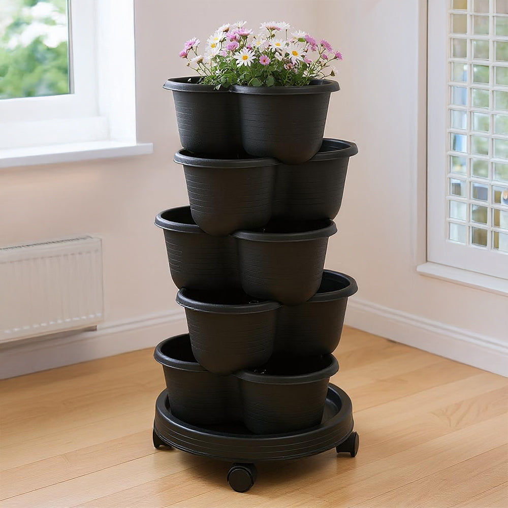 The three-dimensional three-petal flowerpot, strawberry pot, can be multi-layered for vegetable and fruit planting. It is made of pp plastic with five layers, black/ white/ green, and measures 31.5*31.5**13.5cm